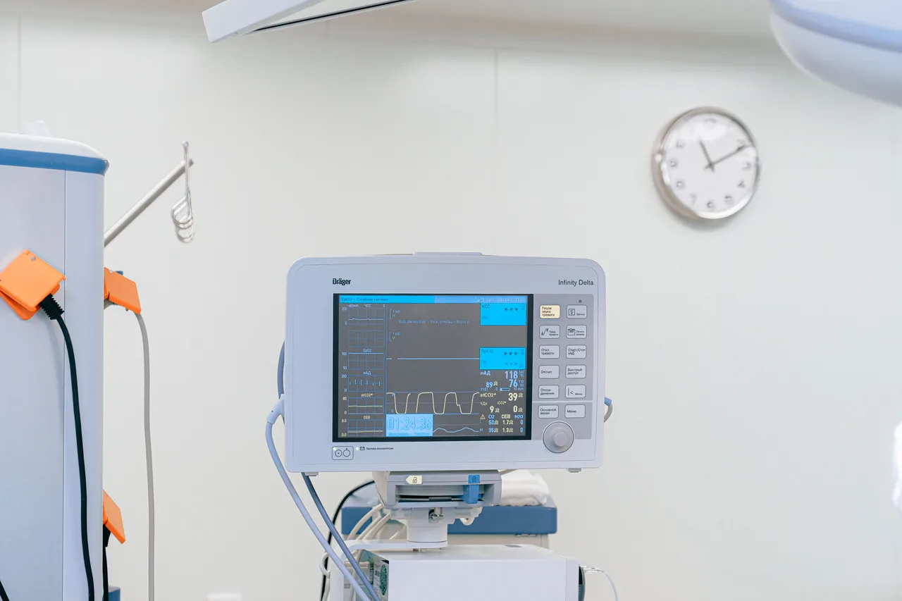 A patient monitor and clinical equipment in a hospital room